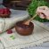 Варенье из малины Фермерская артель Сельский пир в глиняной плошке Маматаки и рука ребёнка с ложкой